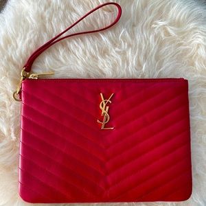 YSL Monogram print leather wristlet.